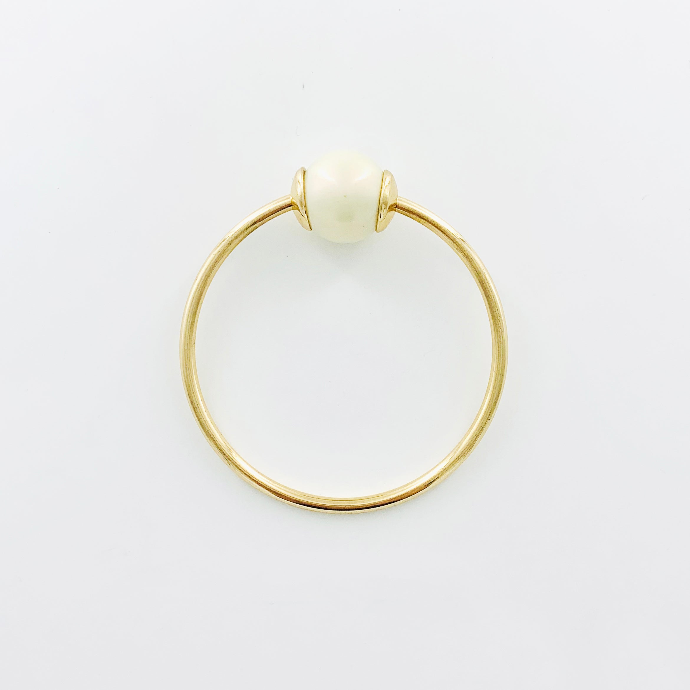 Gold Bangle with iridescent pearl stone