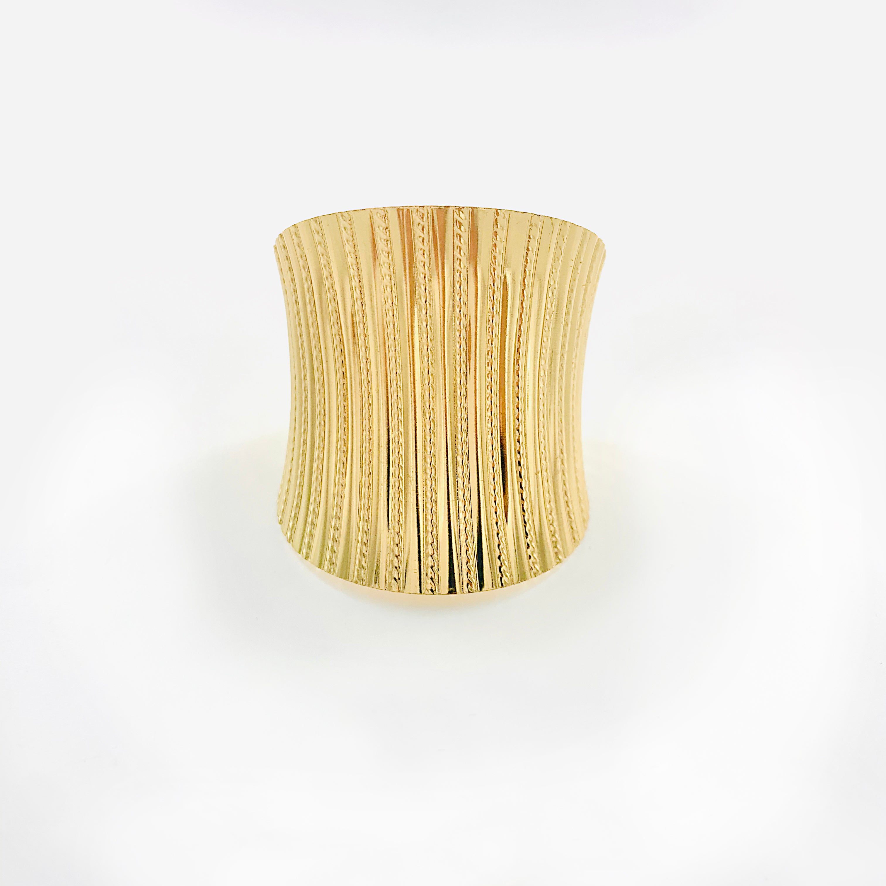 Curved gold cuff with Linear lines