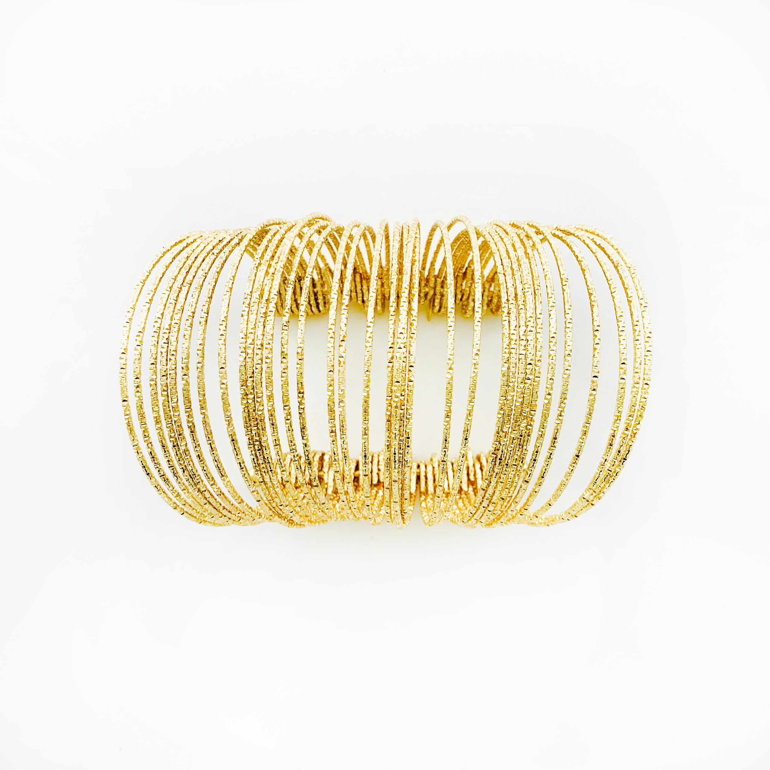Ethnic-inspired glittery gold bangles
