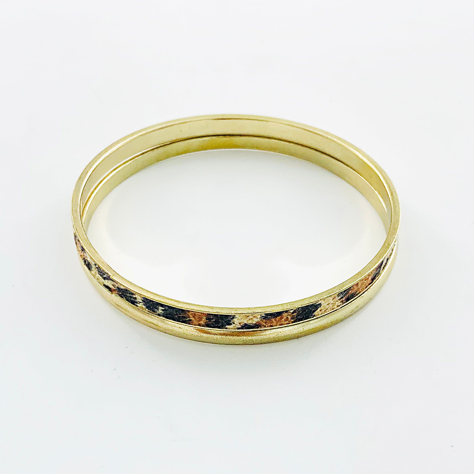 Leopard-printed and gold bangles
