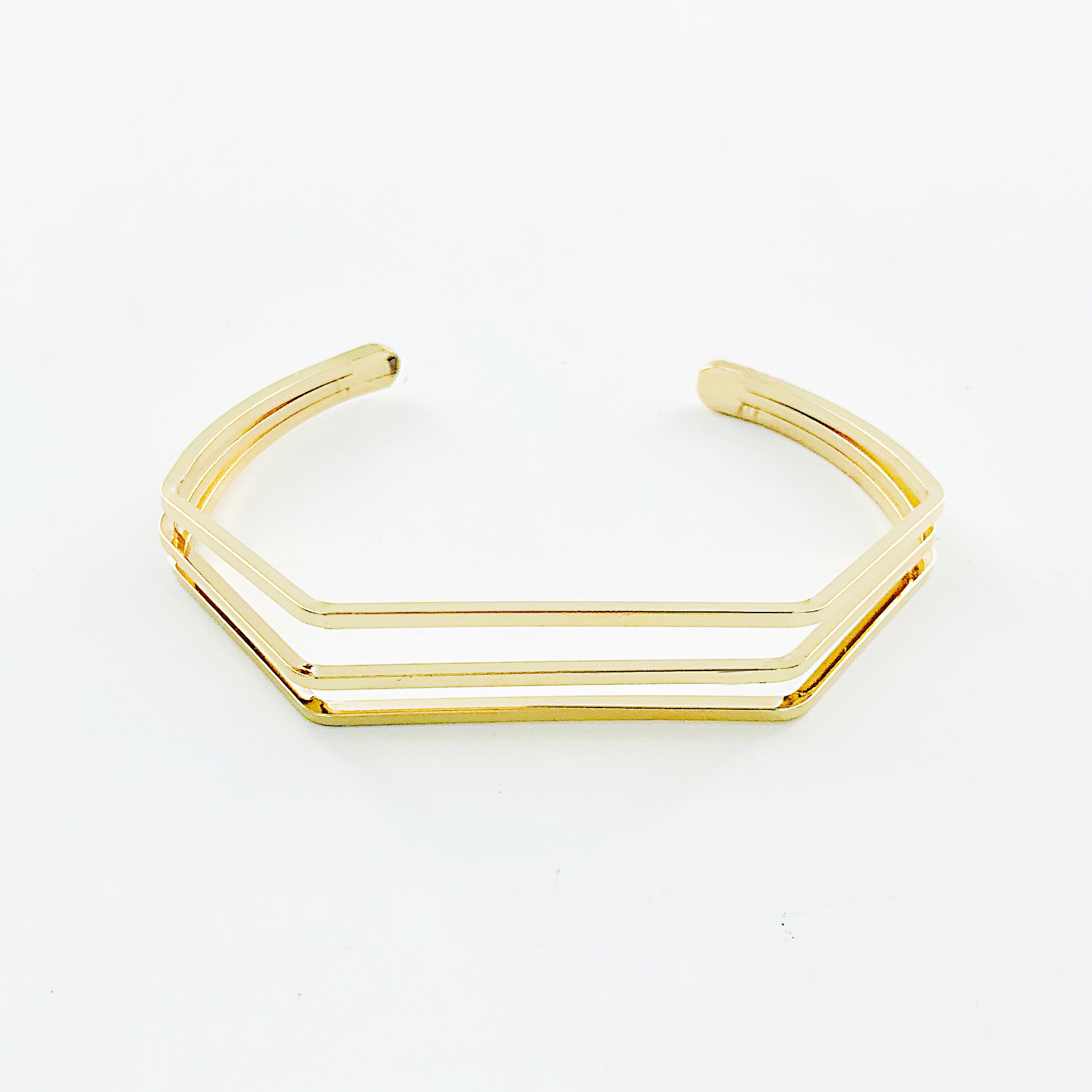 Thin gold bangles with geometric line design