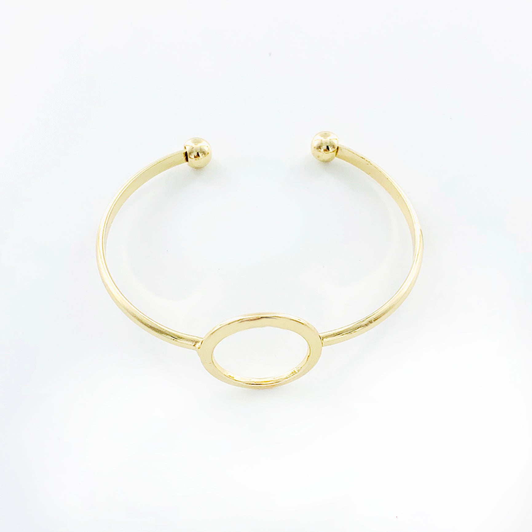 Thin gold bangles with hollow circle design