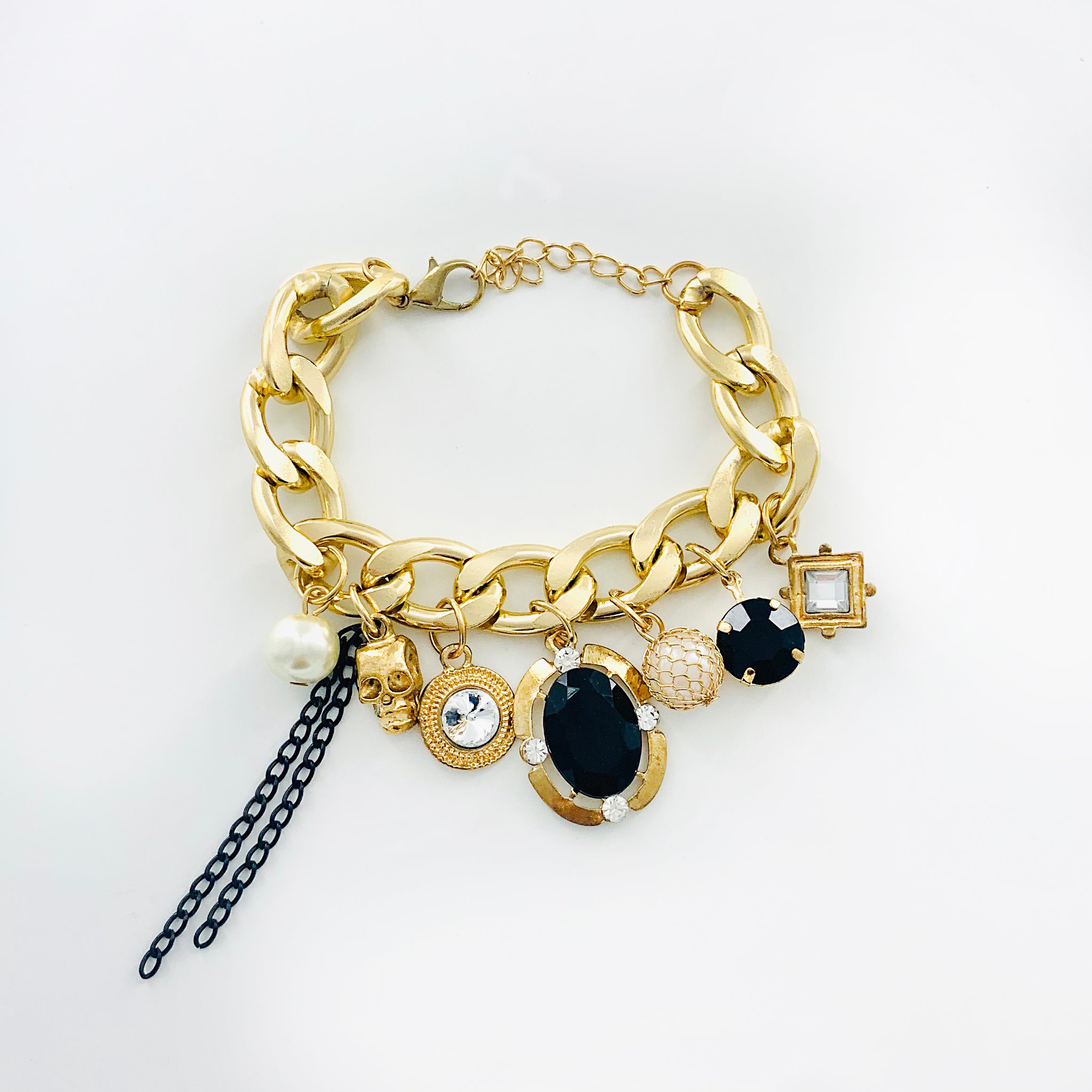 Gold chunky chain with skull and gem charms