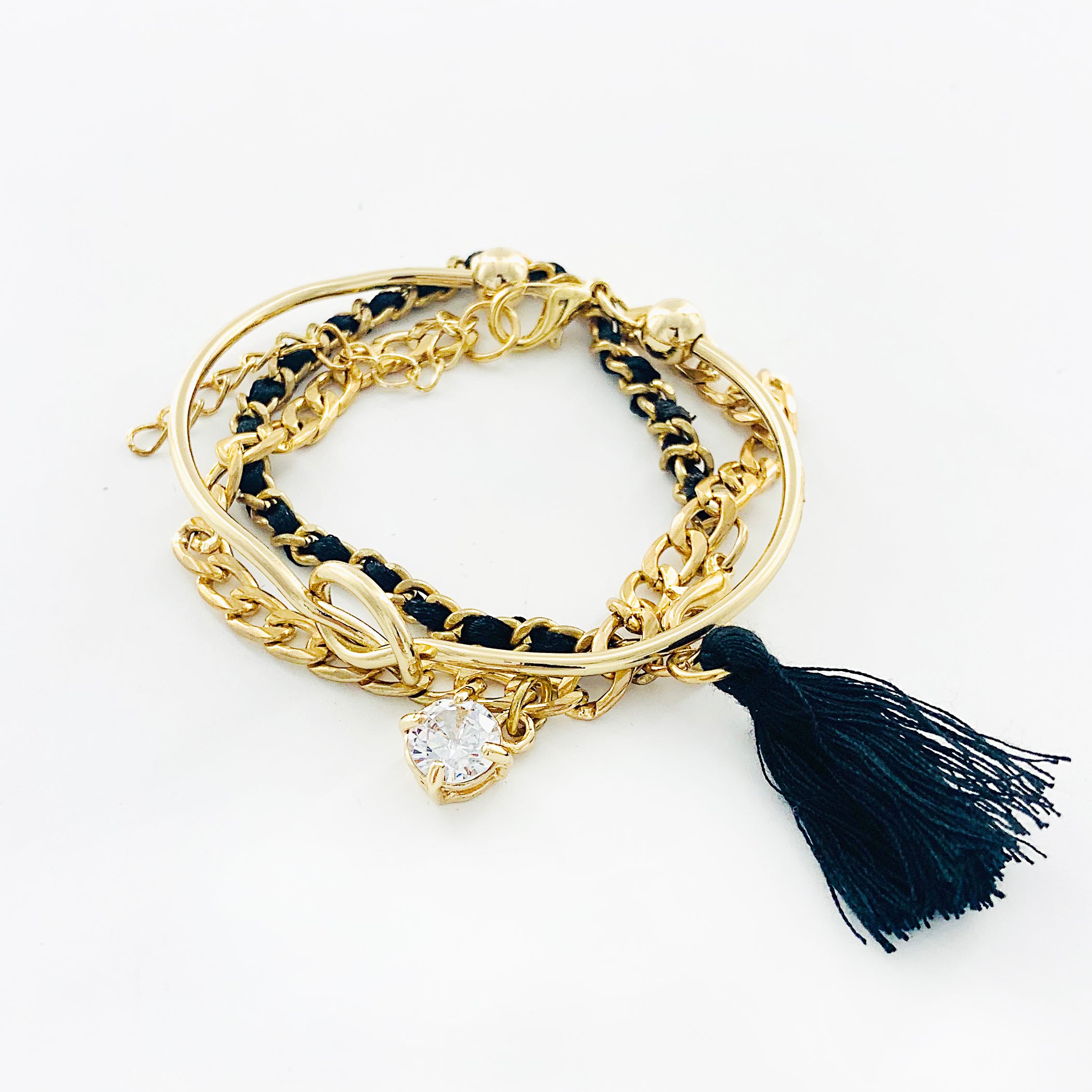 Black and gold multi bracelets with tassel and diamante charm