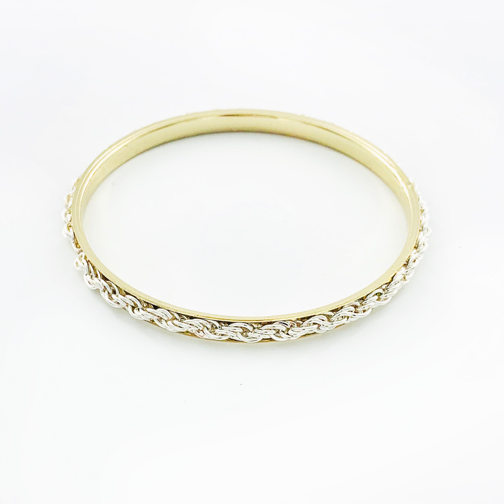 Silver braided chain on thin gold bangle
