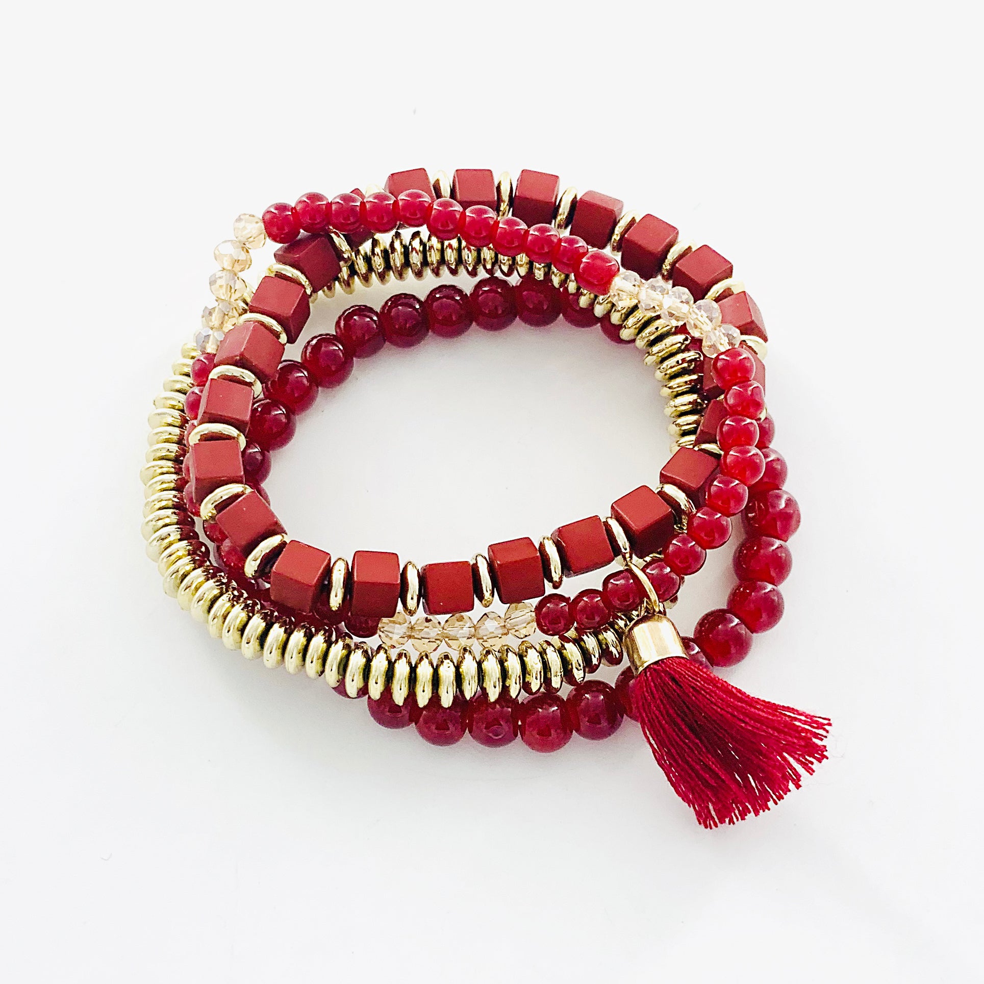Red and gold multi bracelets with tassel charm
