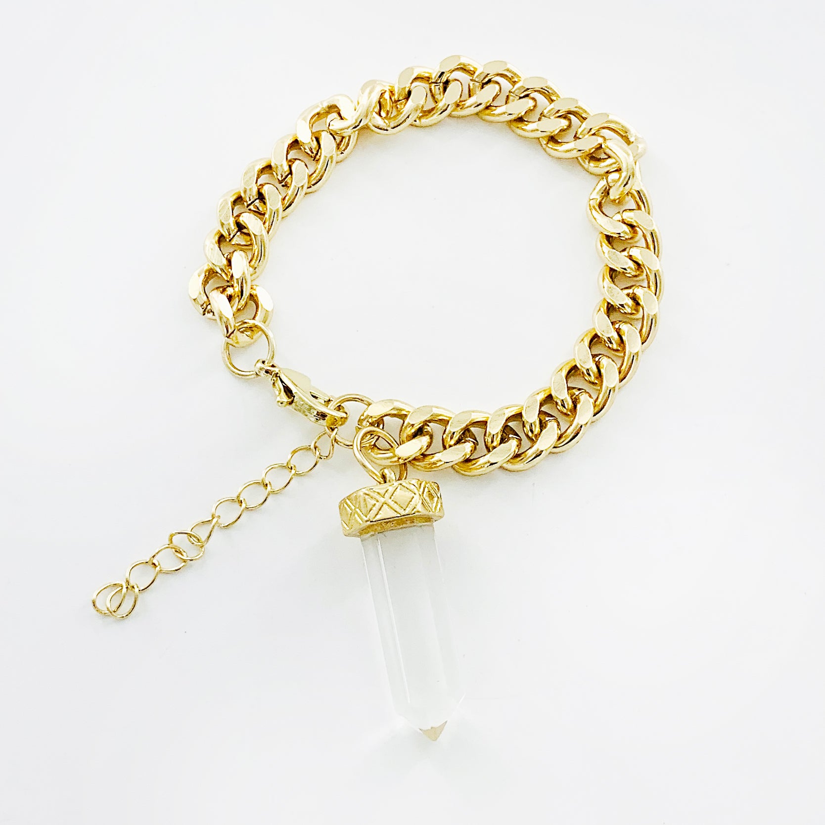 Chunky gold chain bracelet with clear obelisk stone