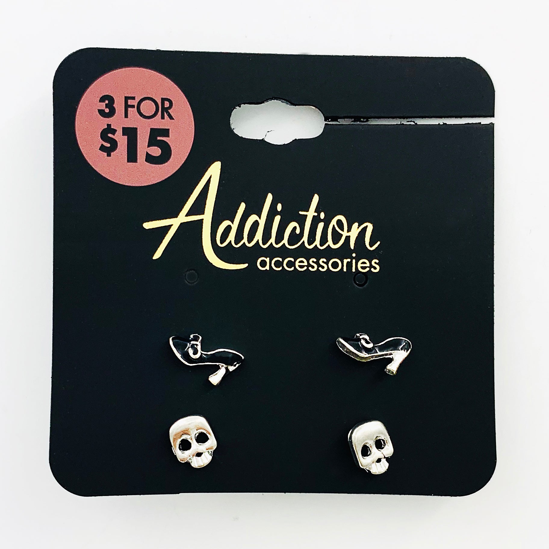 Silver and black skull and heels ear studs