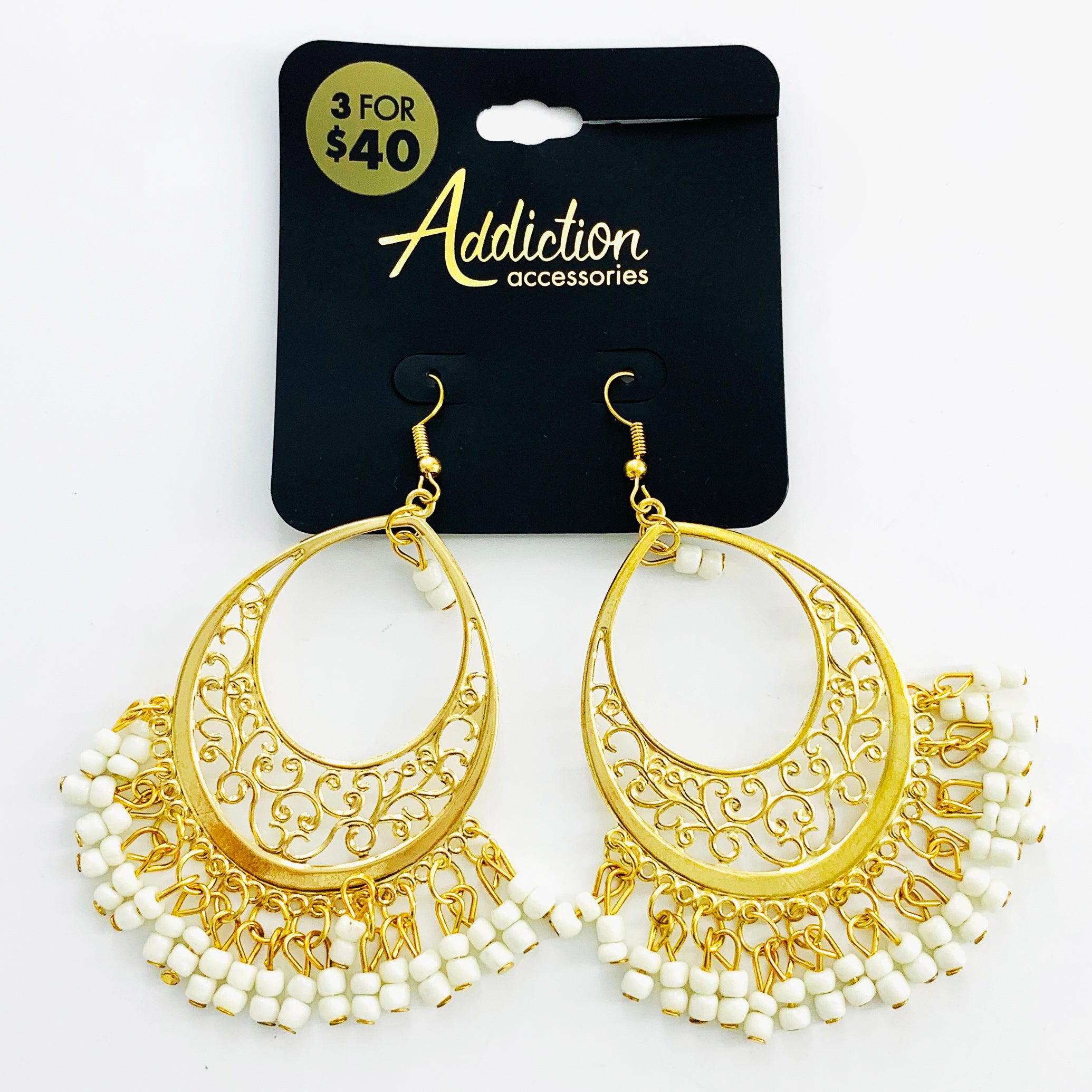 Ethnic-inspired gold earrings with white beads