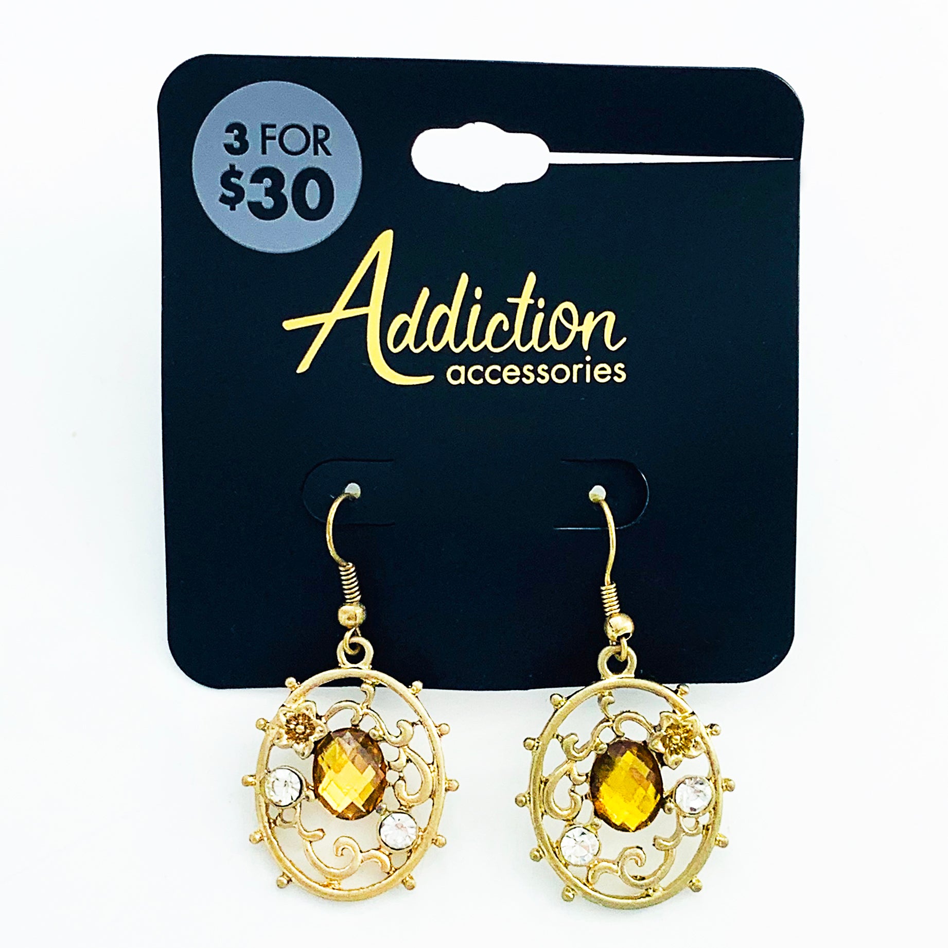Ornate earrings with yellow facet gems