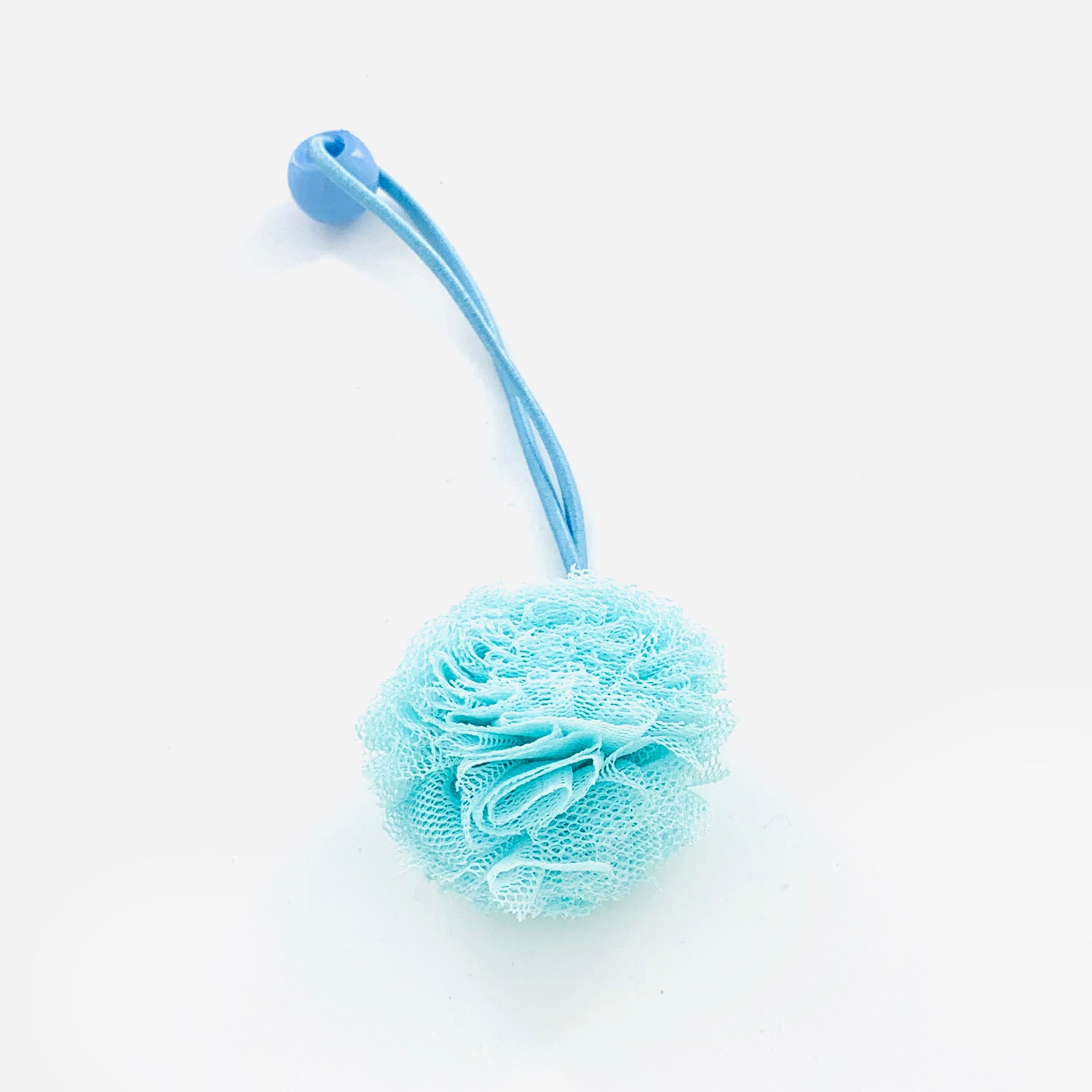 Turquoise rubber band with fluffy fabric pom pom