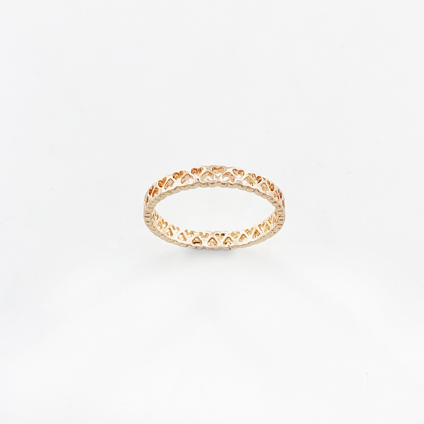 Thin rose gold band with mini heart cut-outs