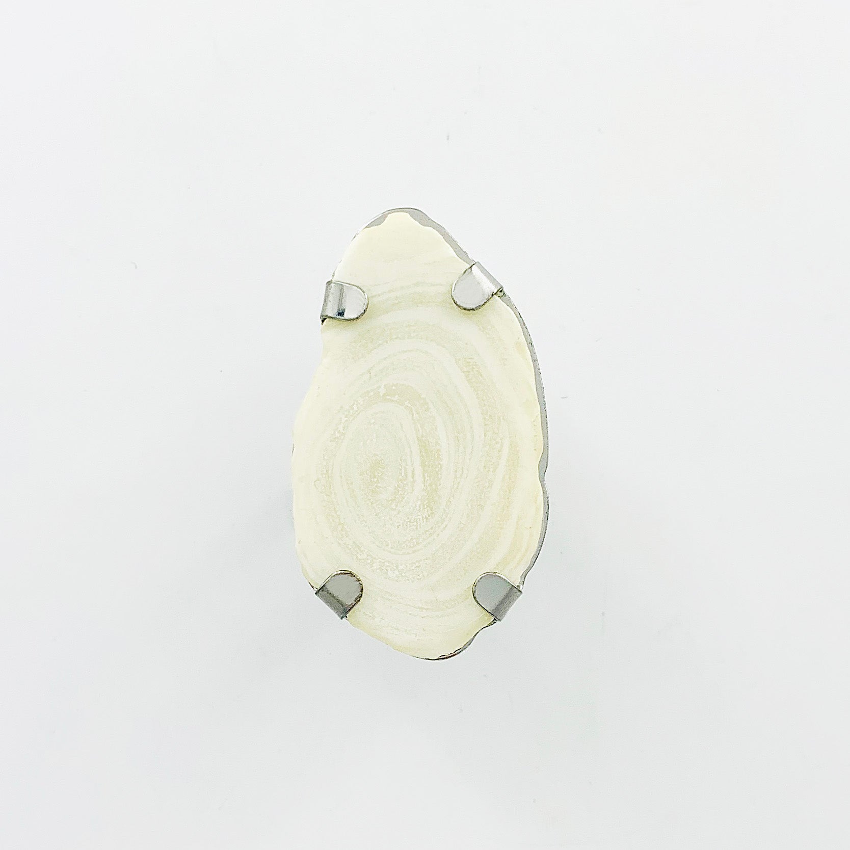 Silver ring with large white stone pendant