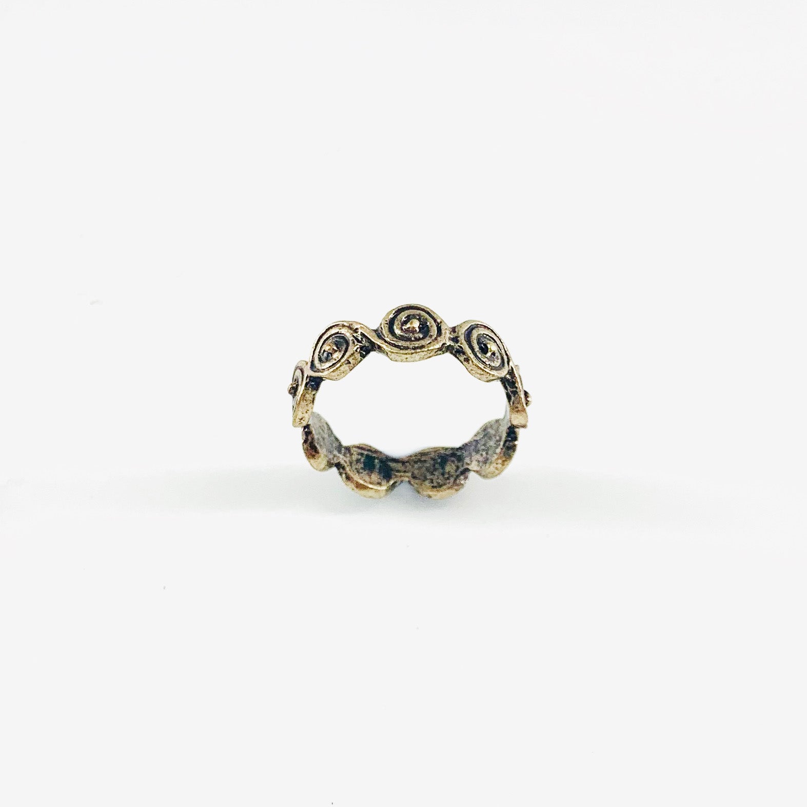 Vintage-styled ring with circular design patterns