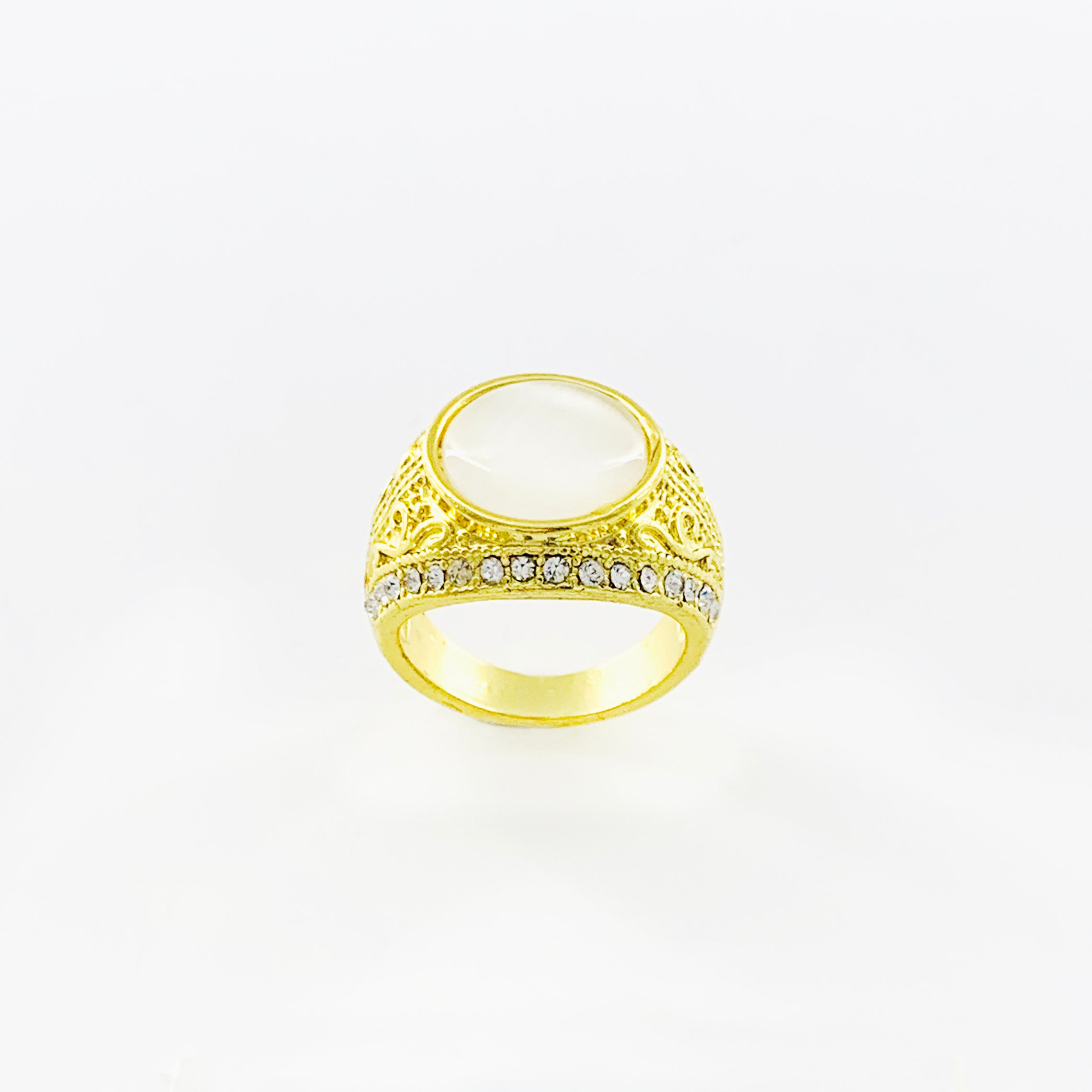 Chunky gold ring with white stone and diamante stones
