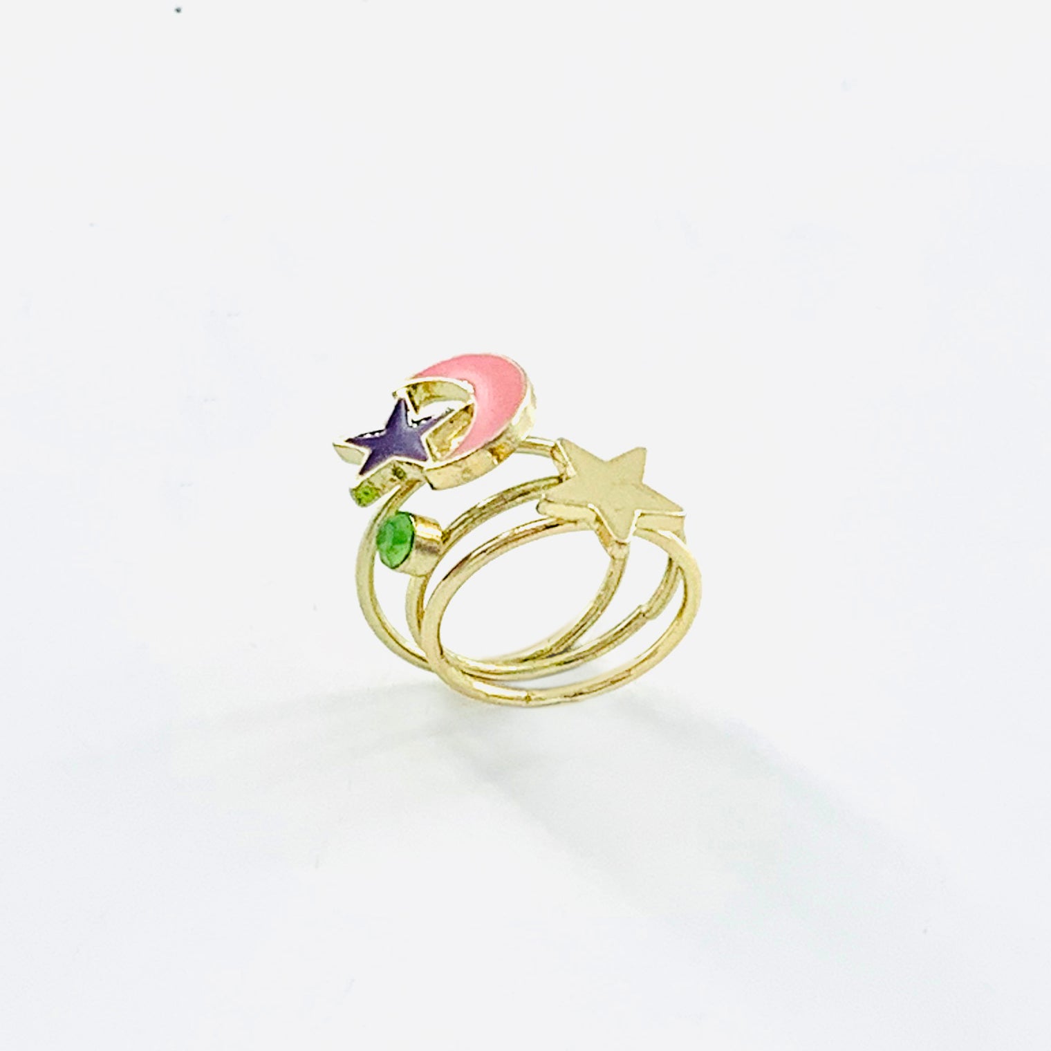 Gold pinky rings with pink crescent and stars